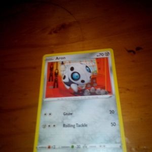 Pokemon card aron 70 health take away 20 and 50 damage metal energy.